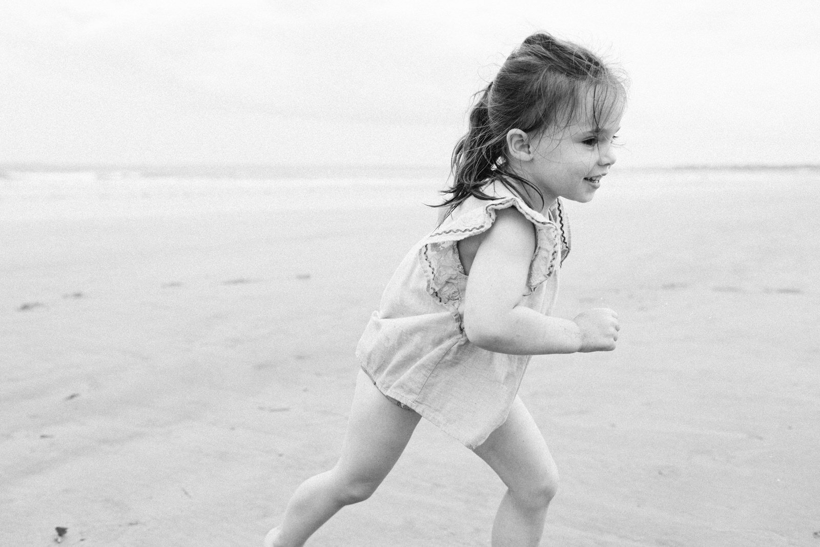 maine-vacation-photographer-girl-running-on-beach-1.jpg
