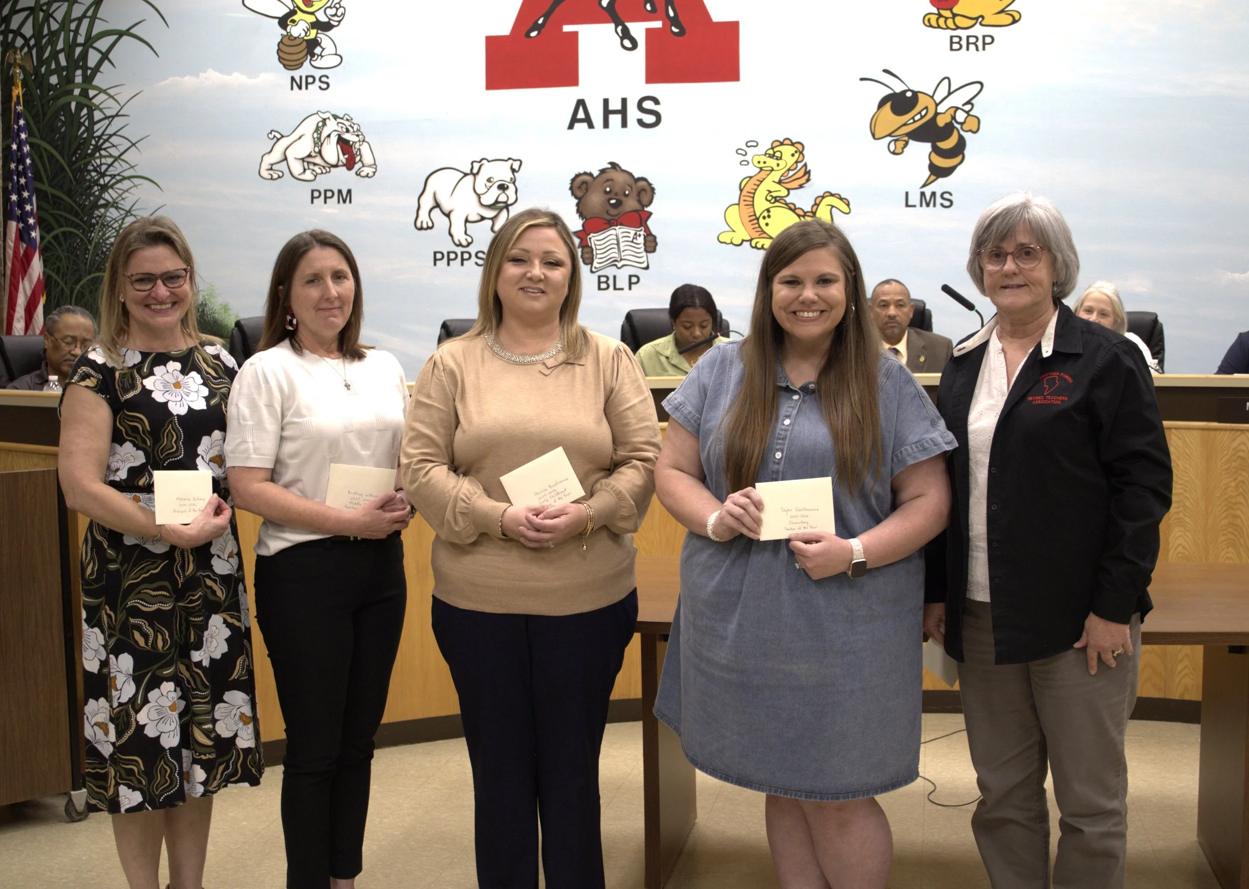  Assumption Parish Retired Teachers Association President Linda Gaudet presented the parish’s top winner with monetary gifts. &nbsp;Those district winners receiving gifts, pictured from left, are Principal of the Year Melanie Bellamy, Labadieville El