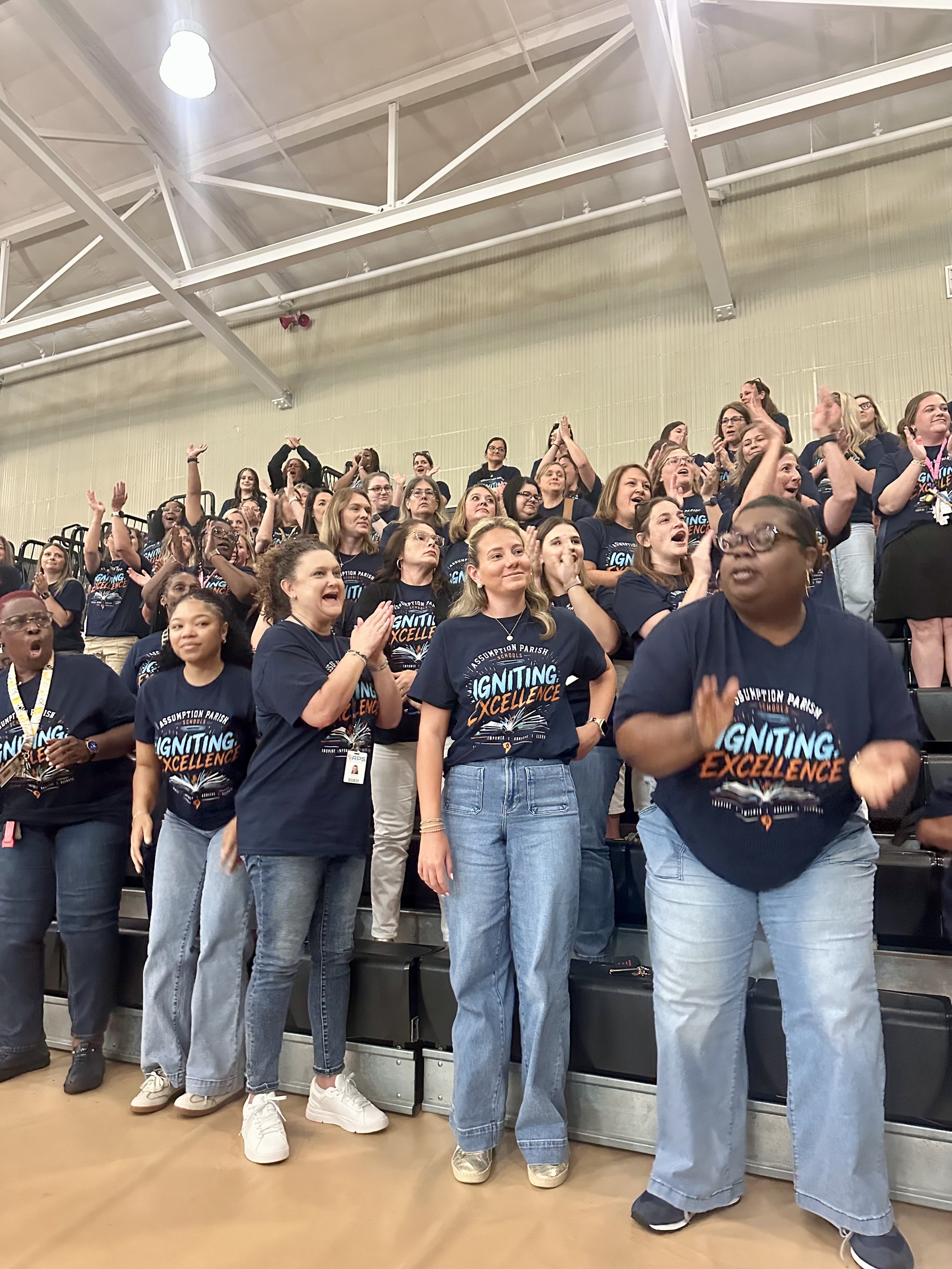  Teachers and staff at Napoleonville Primary School stand to celebrate their recognition by State Superintendent Dr. Cade Brumley, who cited their tremendous gains in the state’s accountability scoring program. The employees are wearing t-shirts with