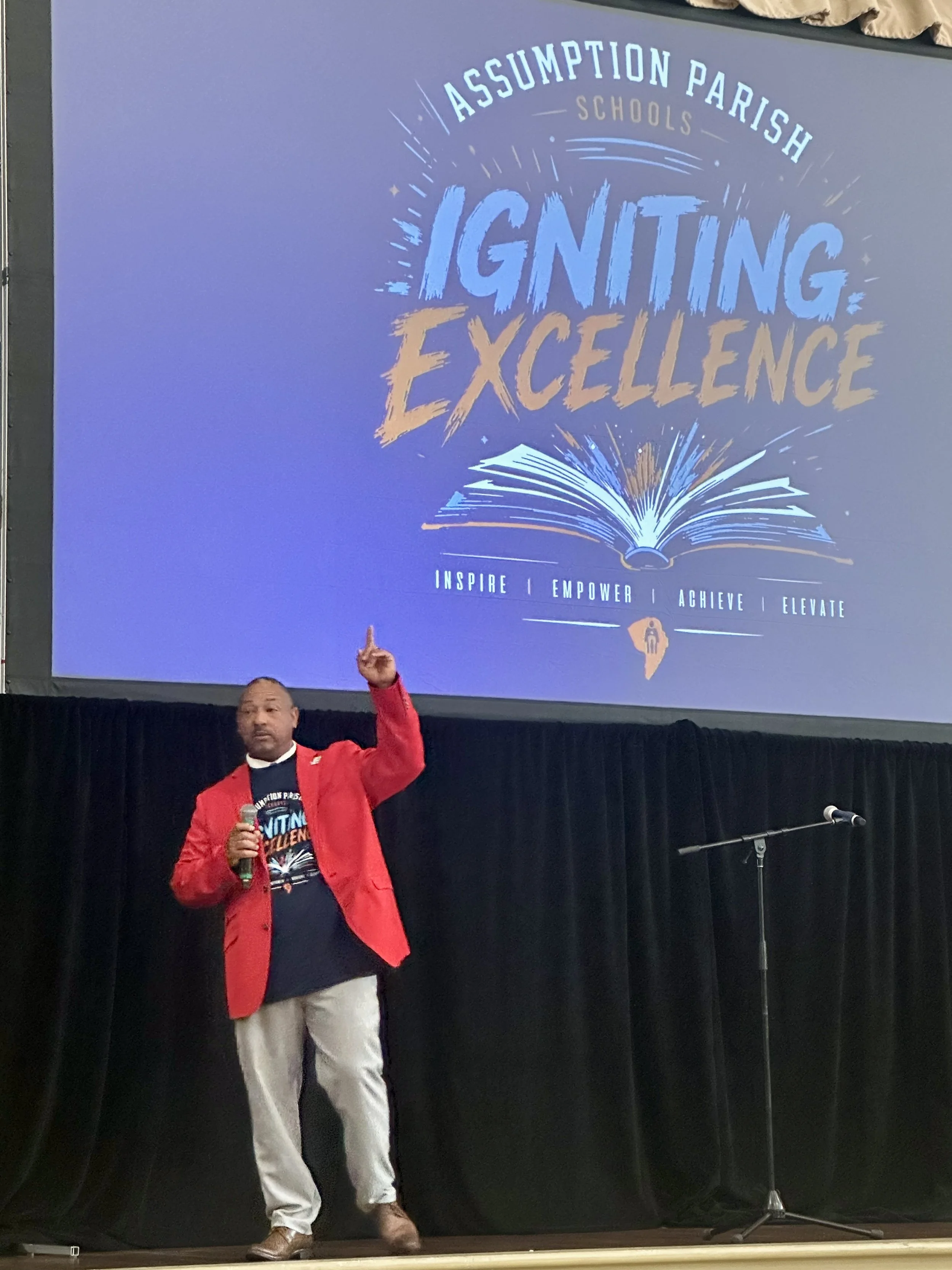  Assumption Parish School Superintendent Dr. John Barthelemy speaks to the congregation of school employees at the Assumption Parish Civic Center during a special “back-to-school” kick-off celebration. 