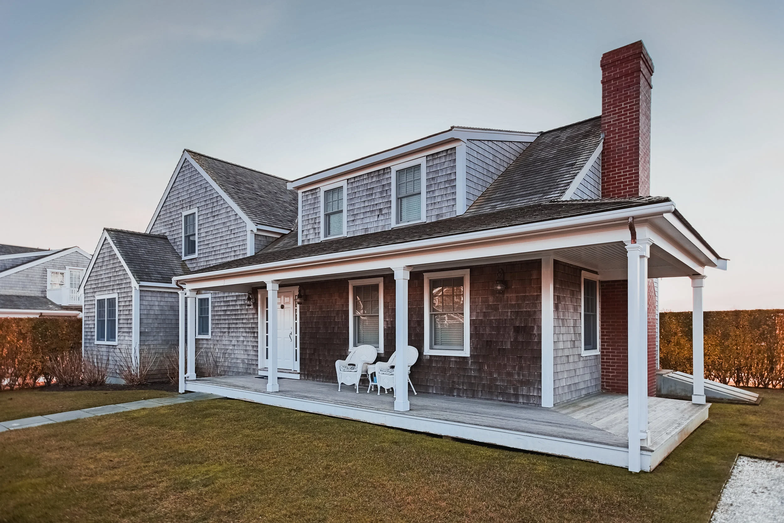Beautiful traditional Nantucket ocean home. Only problem? Dead grass & overcast.