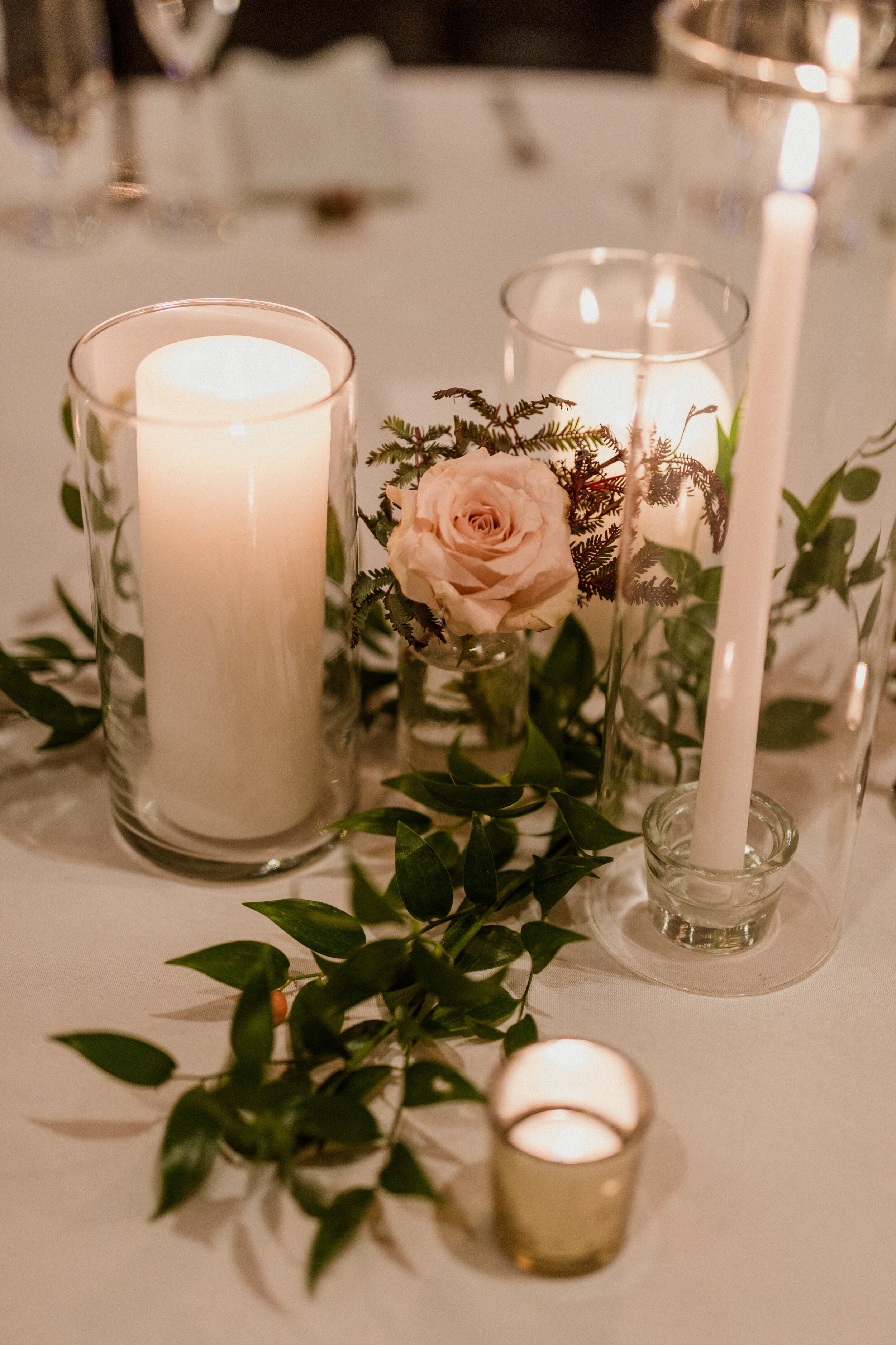 12 Wedding Reception Centerpieces Candles Florals candlesticks Greenery.jpg