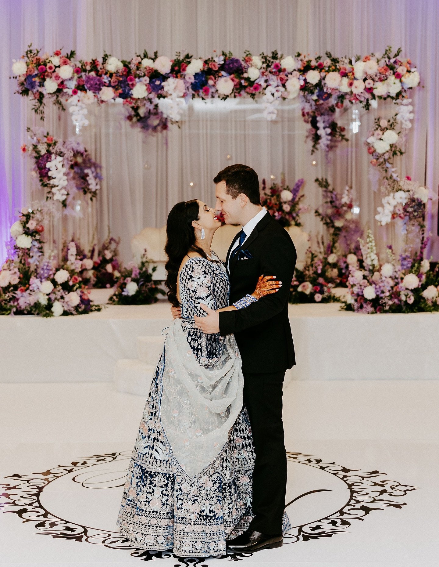 When one photo just won&rsquo;t do because every aspect of Priya &amp; Nolan&rsquo;s wedding was perfection! 
😚
The saree. The florals. The personalized, dramatic dance floor. The whole vibe. Doesn&rsquo;t it just pull you in?!
😍
Photography // @ra