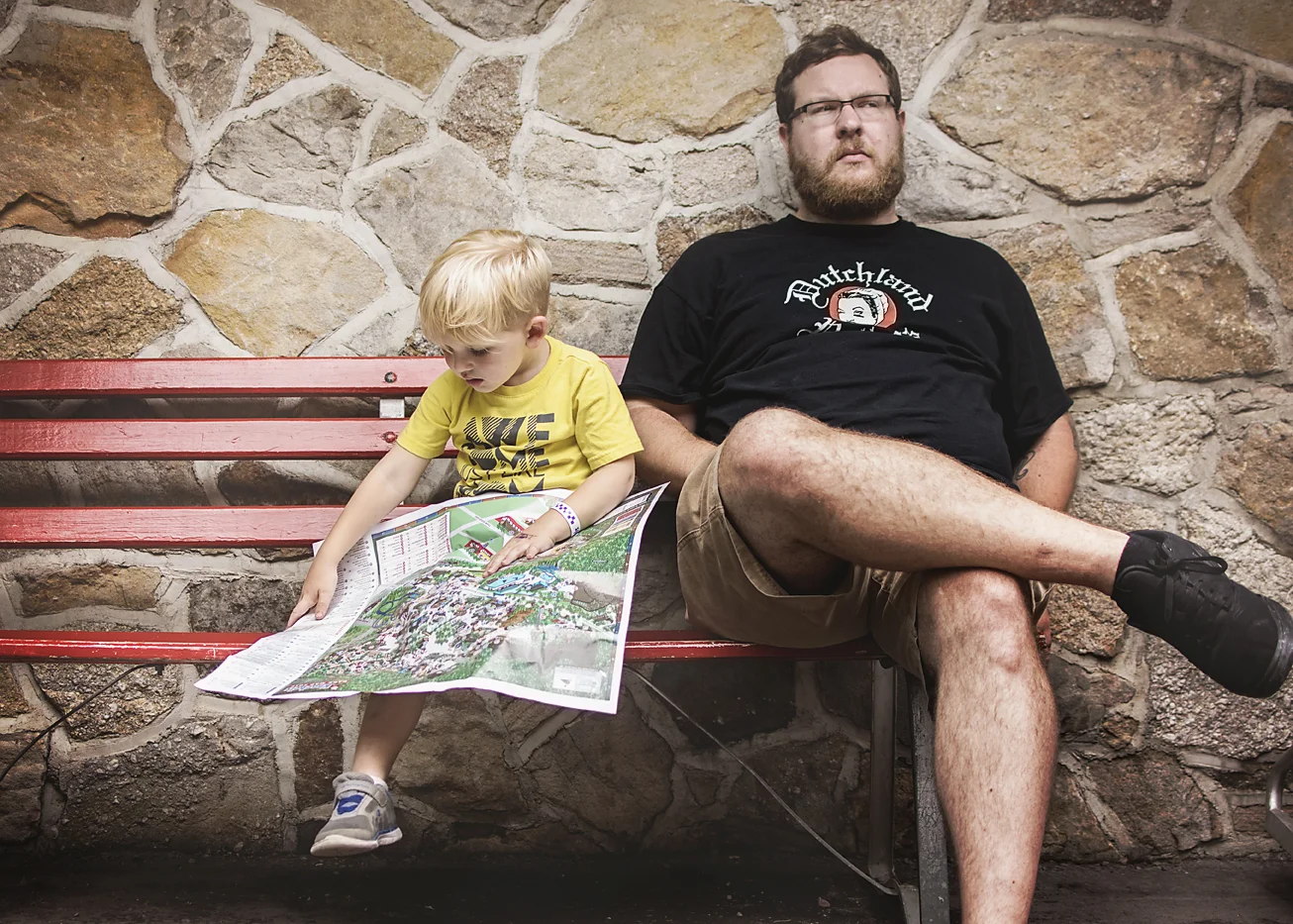 This kid loves his maps. He couldn't wait to find all the rides he NEEDED to ride while everyone else took a potty break. 