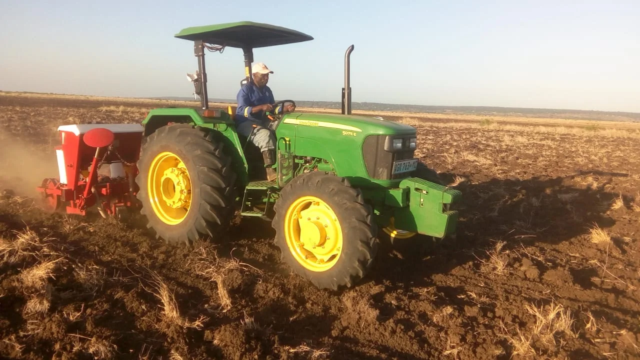 This is our tractor planting corn just before the rainy season