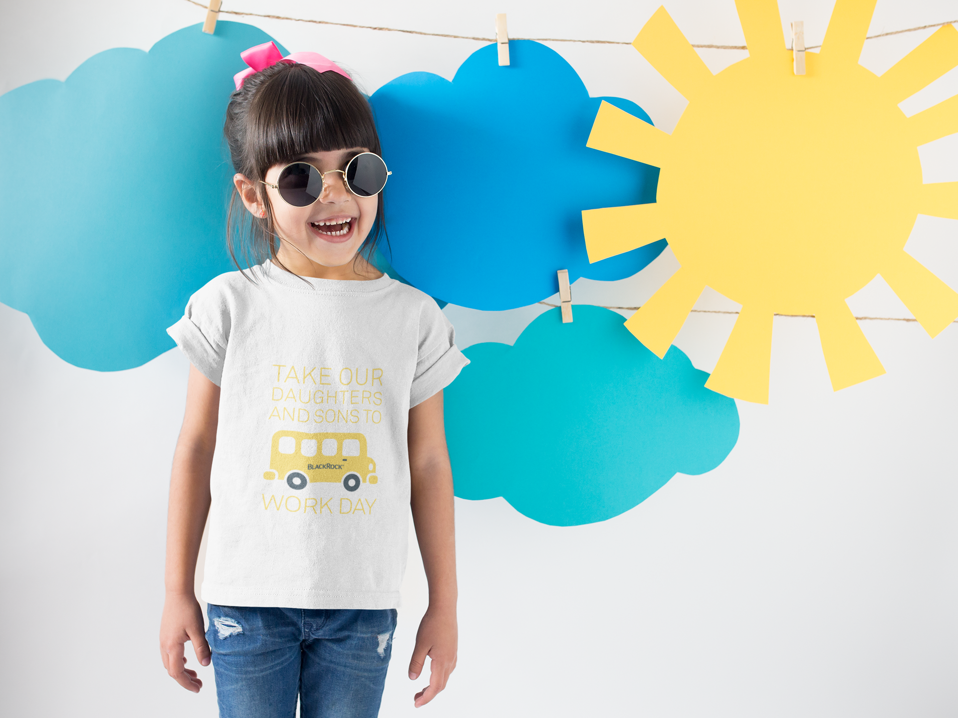 smiling-girl-wearing-a-round-neck-tshirt-template-near-cardboard-sun-and-clouds-a19480.png