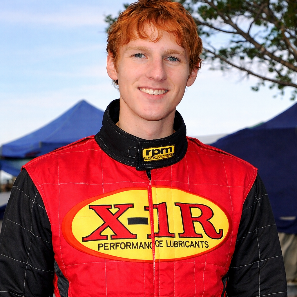 Smiling racer at a race event.png