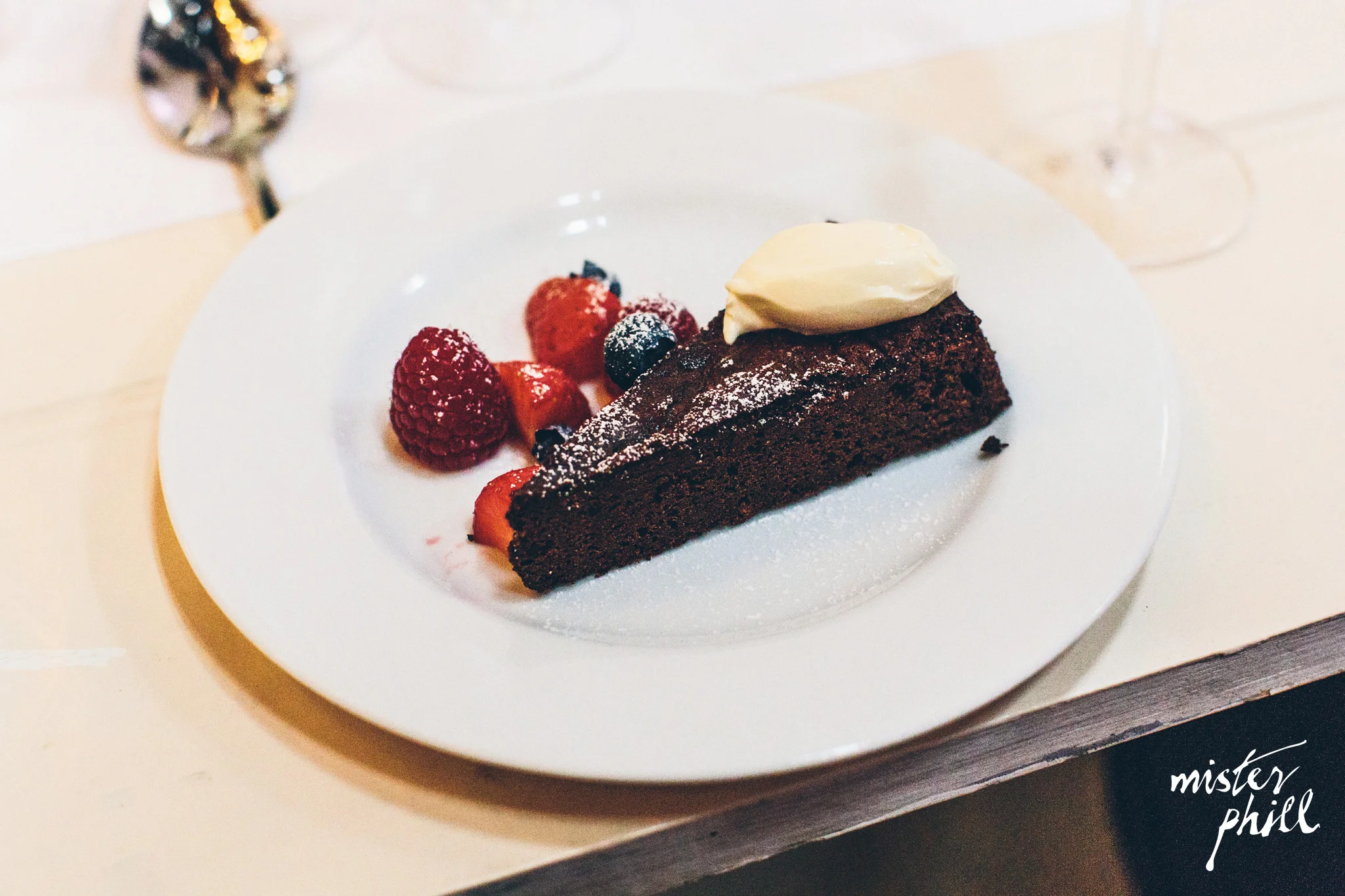 Chocolate torte with crème fraiche and summer berries