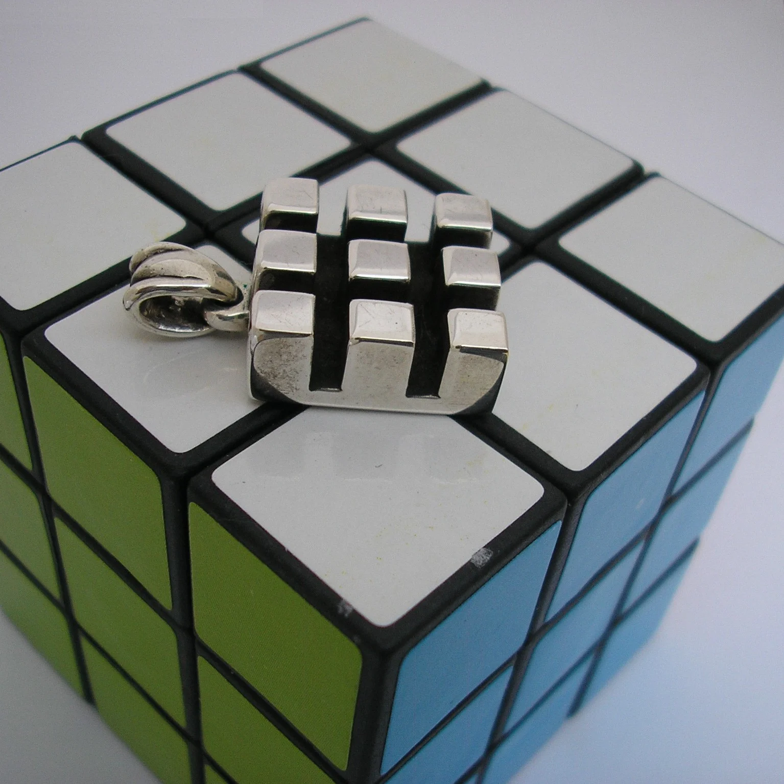 MaleGridPendant on Cube.JPG