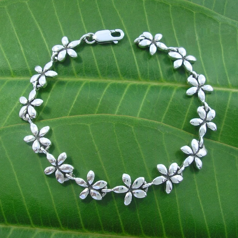 FrangipaniBraceletOnLeaf1000.jpg