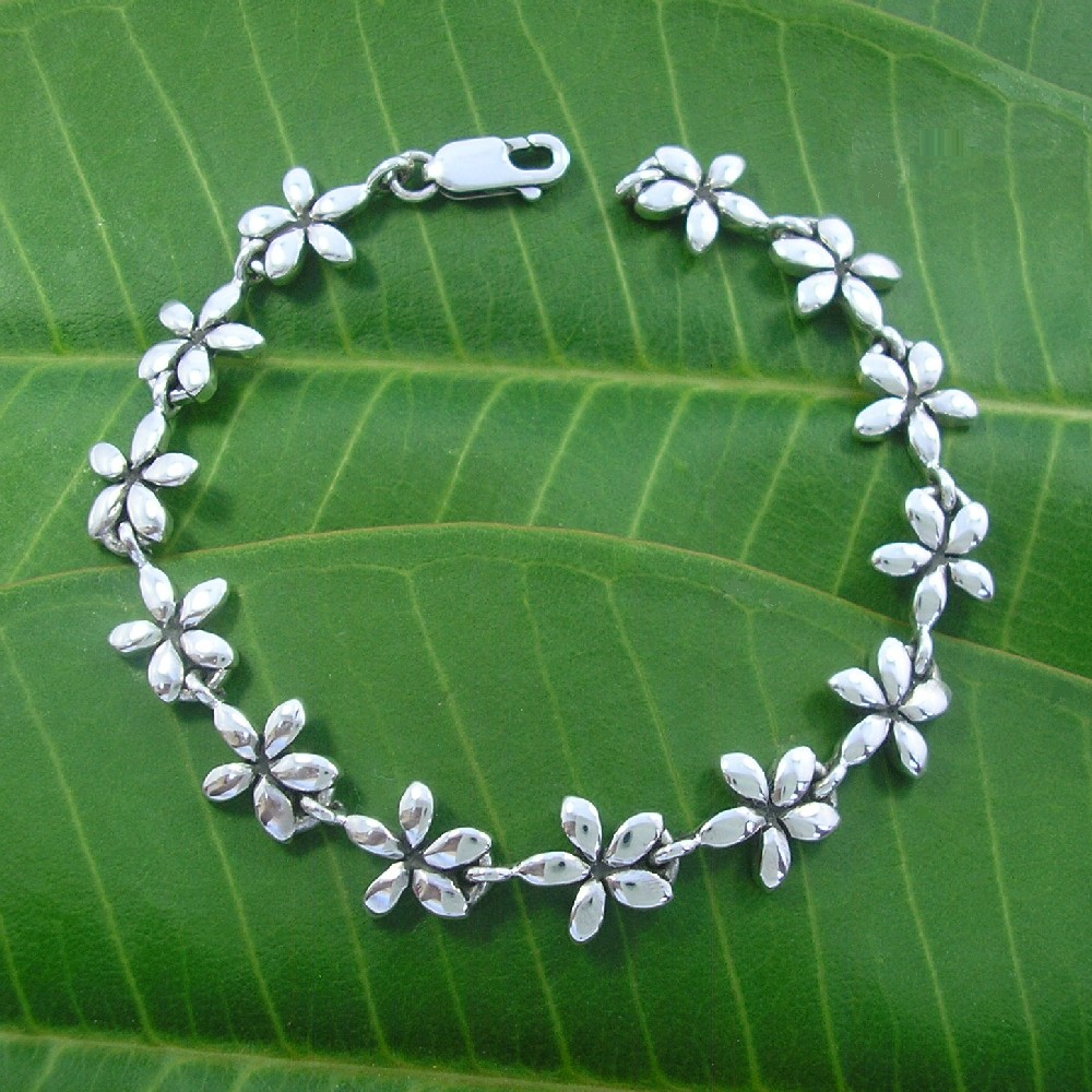 FrangipaniBraceletOnLeaf1000.jpg