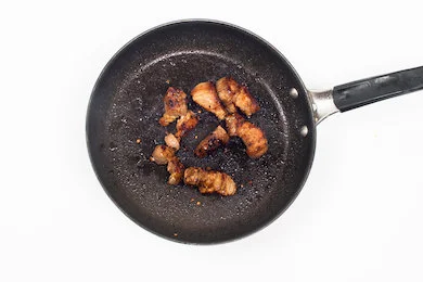 Turn to medium-low heat, and place the pork belly slices onto a non-stick pan. Pan fry for about 4 minutes each side, or until cooked. Turn the pan to high heat and cook for 1 minute each side until a slight crunch starts to form.
