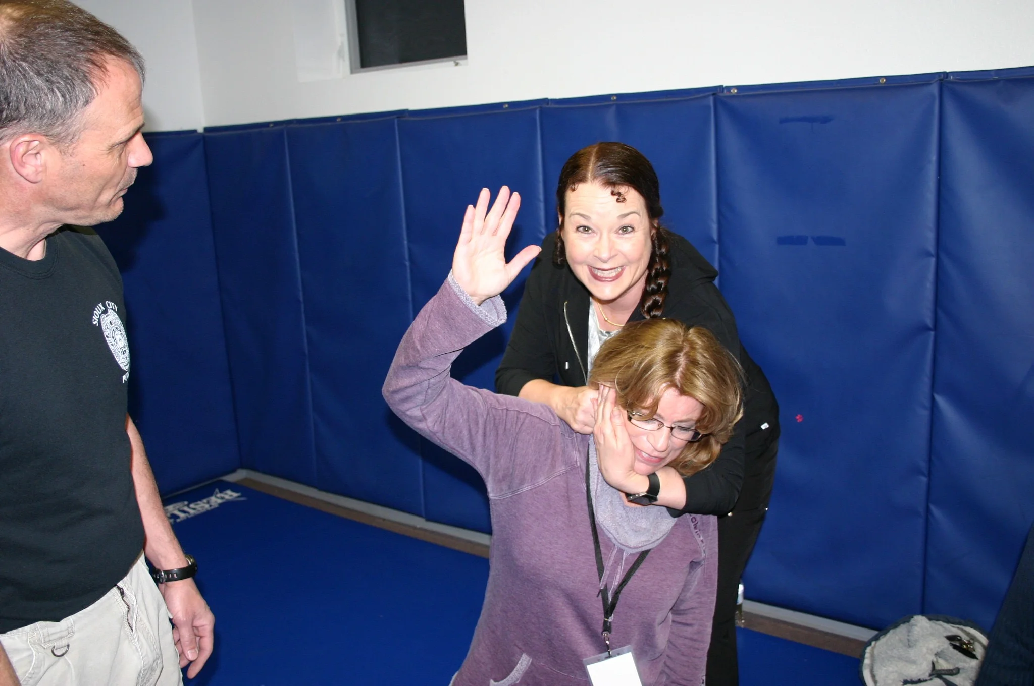 Sgt. Jess Aesoph provides instruction on controlling an unruly guest.