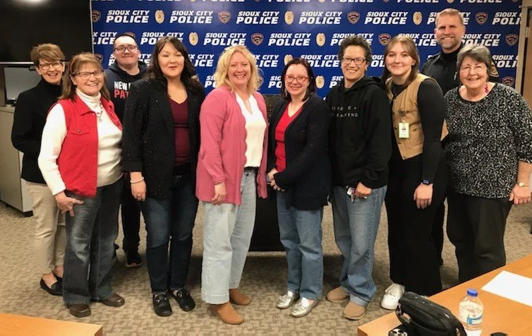 Picture showing nine graduates of the community emergency response team, Sioux City Police Department chief of police Rex Mueller, and volunteer coordinator Rita Donnelly.