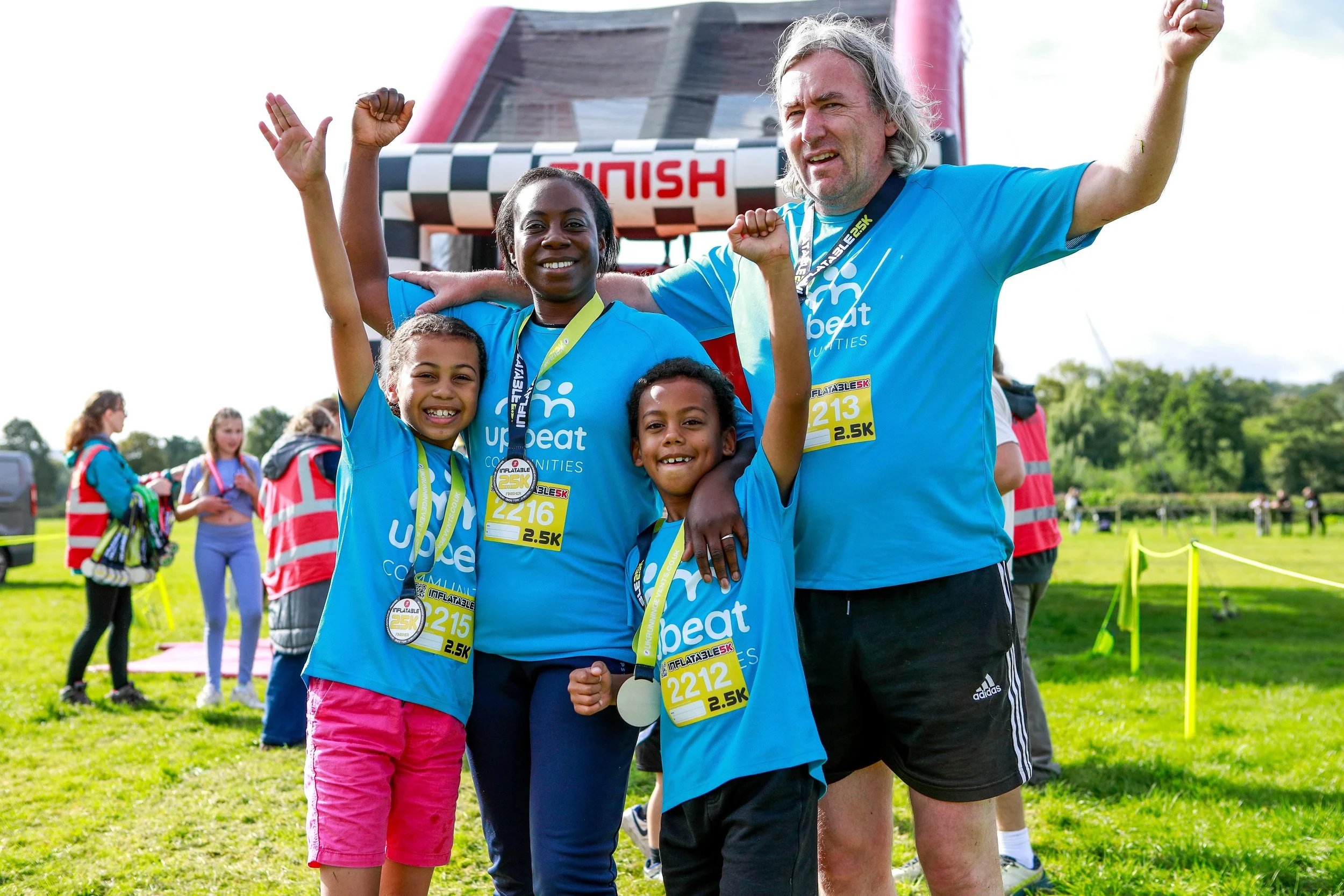 A young family finish the Inflatable 5K race in Bakewell!