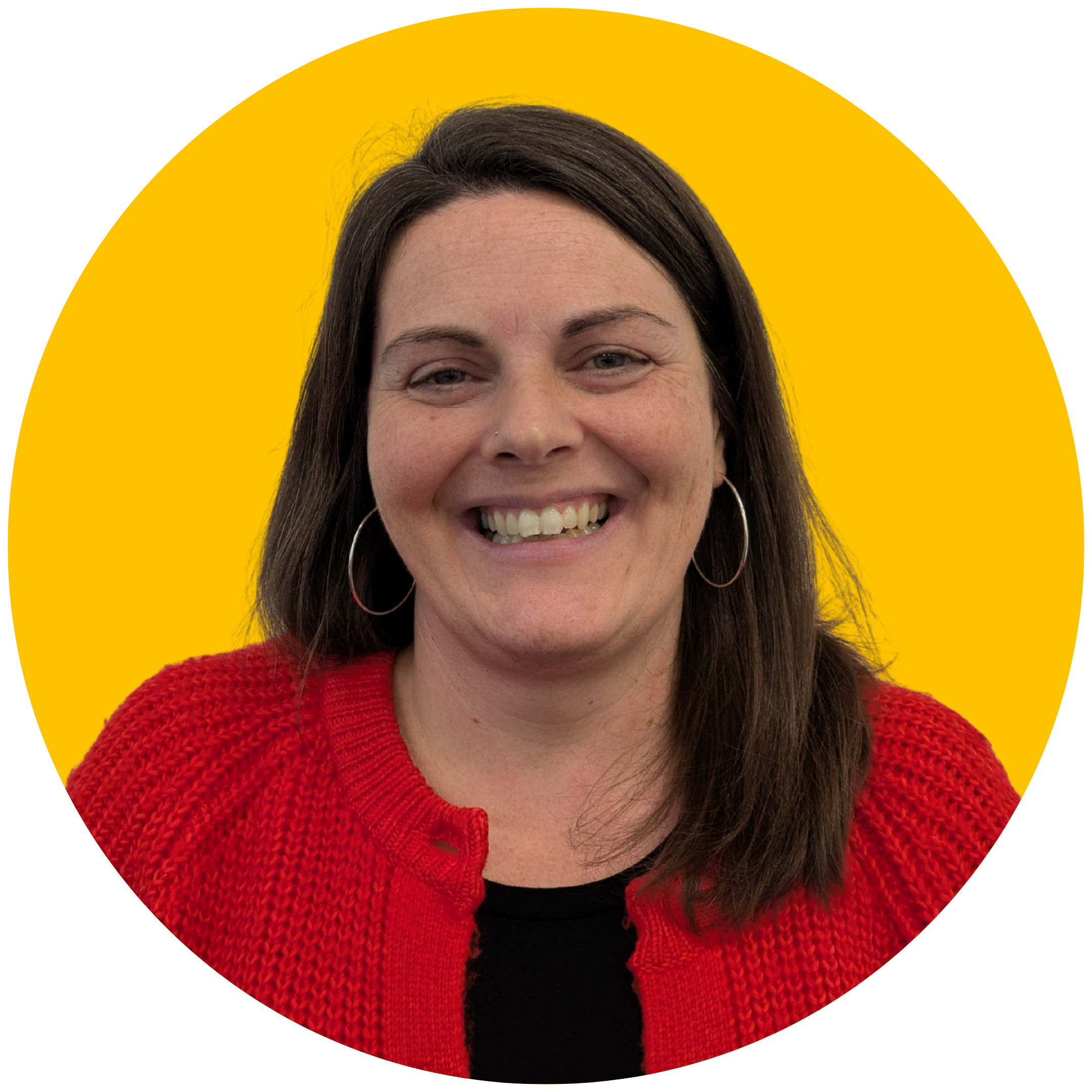 Brown-haired woman smiles at the camera. She is wearing a red cardigan, hoop earrings, and set against a yellow background.