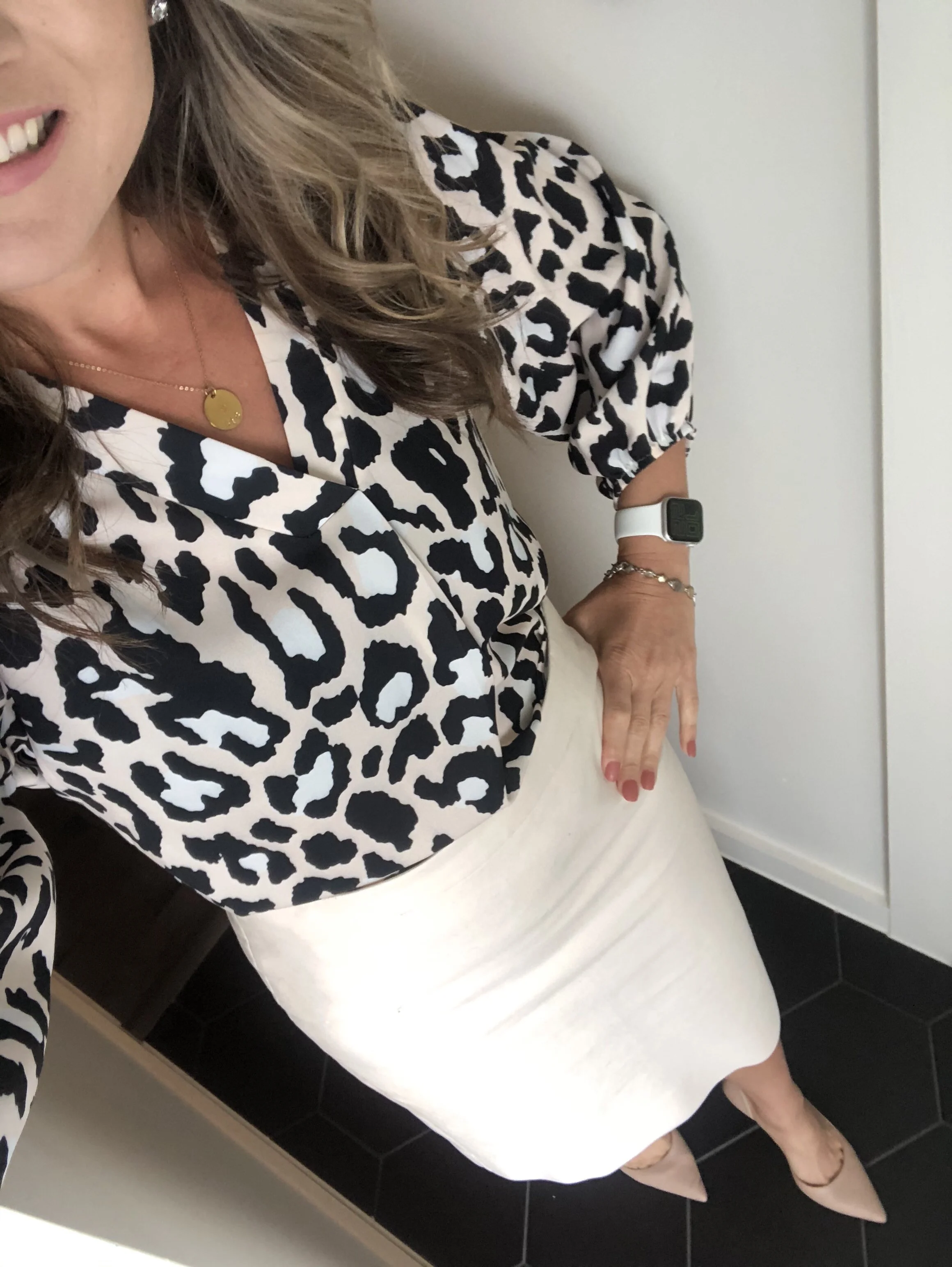 cream skirt black top