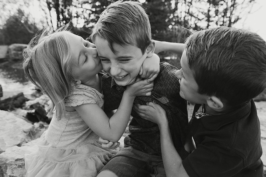 Black and white portrait of siblings embracing.jpg