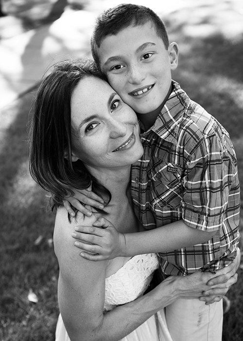 Blakc and White portrait of mom and son hugging.jpg