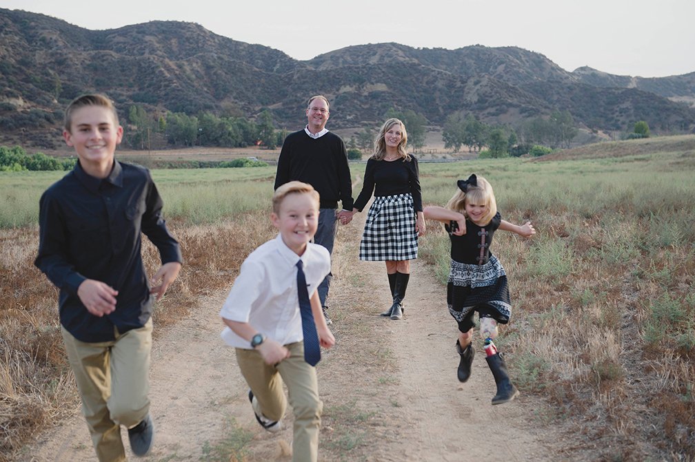 Family of five running thorugh the canyon.jpg