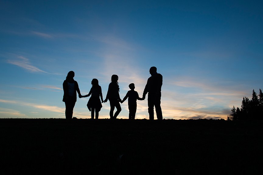 Sunset Silouette of a family of five.jpg