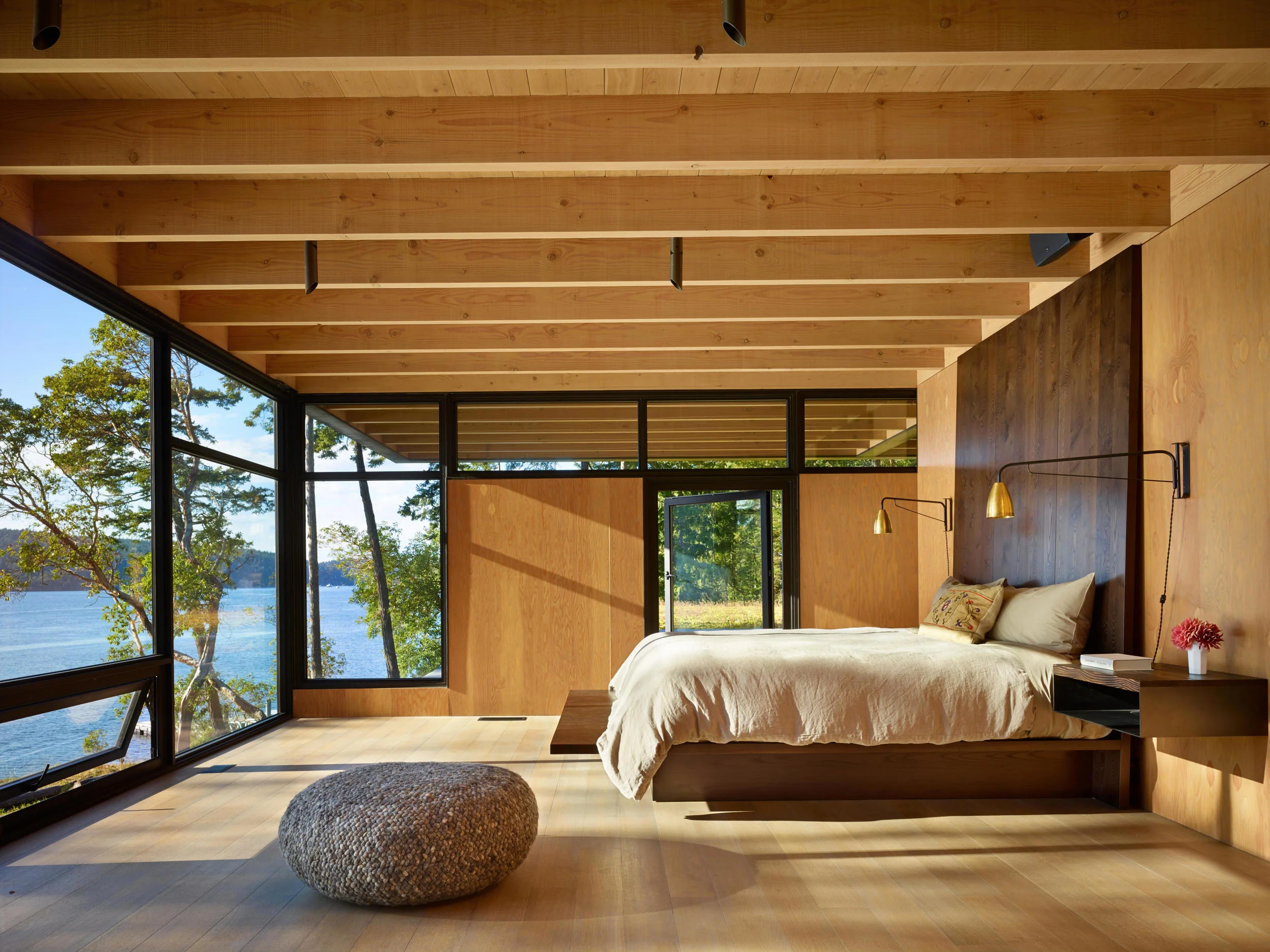 The master bedroom of Pole Pass lodge, in the San Juan Islands, Washington State, designed by Seattle-based Olson Kundig Architects