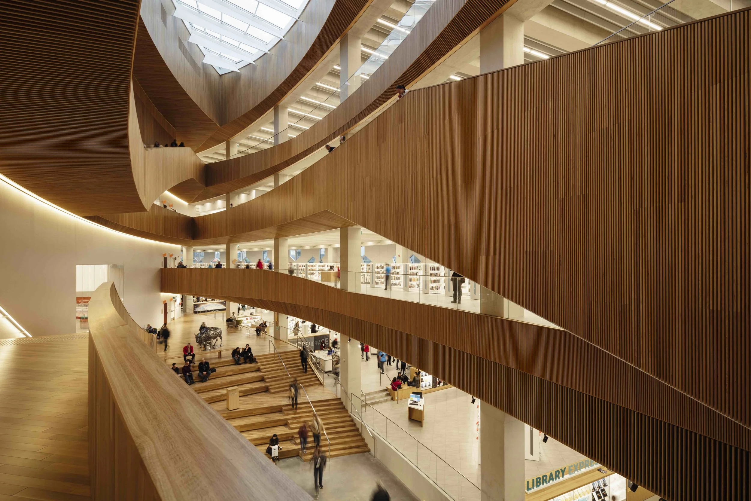 The oculus and central atrium allows natural light deep into the building. Photo by Michael Grimm