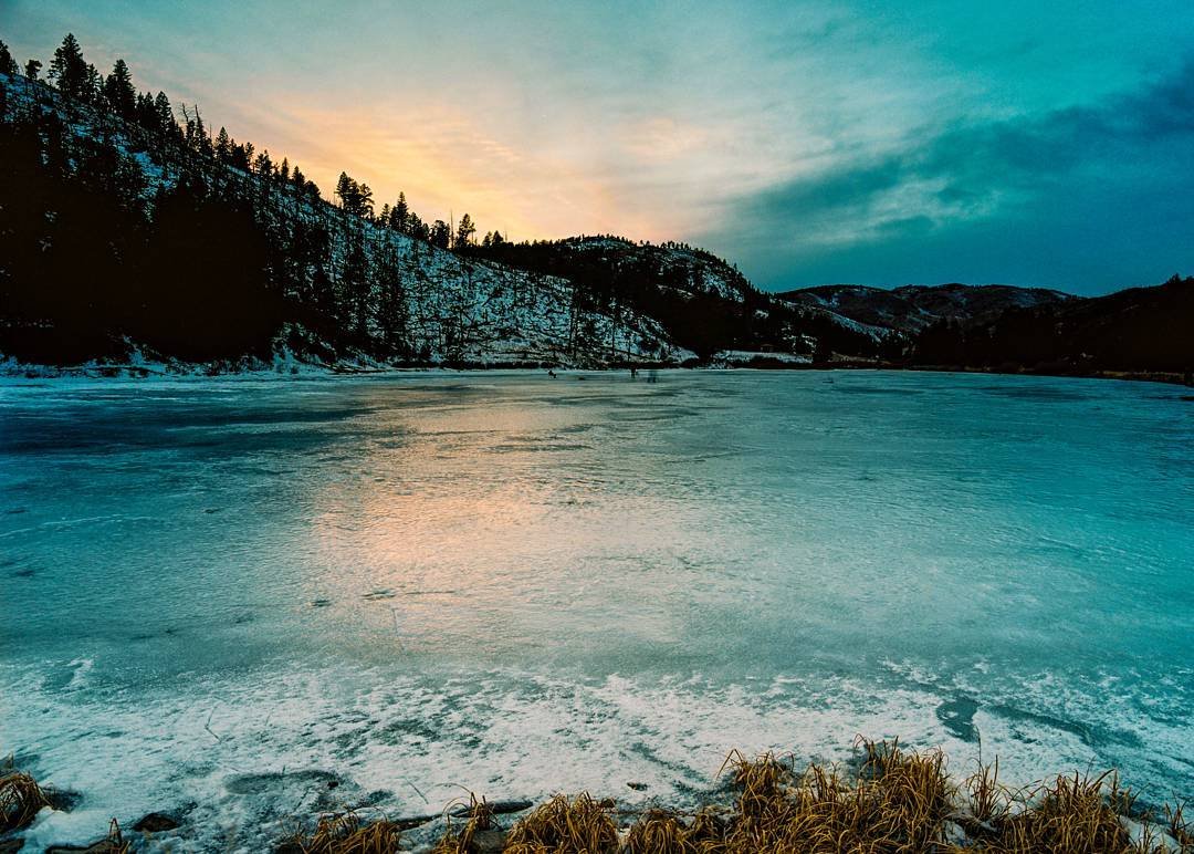 A surreal sunset over a frozen lake. The cracking and shifting of the ice under my feet provided an otherworldly soundscape. 
Pentax 645nII
Kodak ektar 100
Sirui tripod &amp; ball head