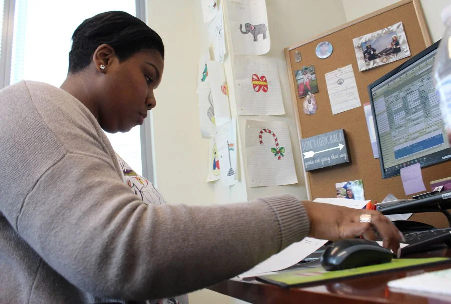 Jervon Lemon works at her desk at Children of the Fallen Patriot Foundation in Reston, VA. Lemon received a college scholarship recipient through the foundation, and is now ae scholarship administrator there. KEN-YON HARDY/STARS AND STRIPES