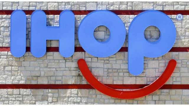 FILE- This May 11, 2017, file photo shows an IHOP sign at a restaurant in Hialeah, Fla. IHOP, which teased a name change to IHOb earlier this month, says the “b” is to promote its burger menu. (AP Photo/Alan Diaz, File)