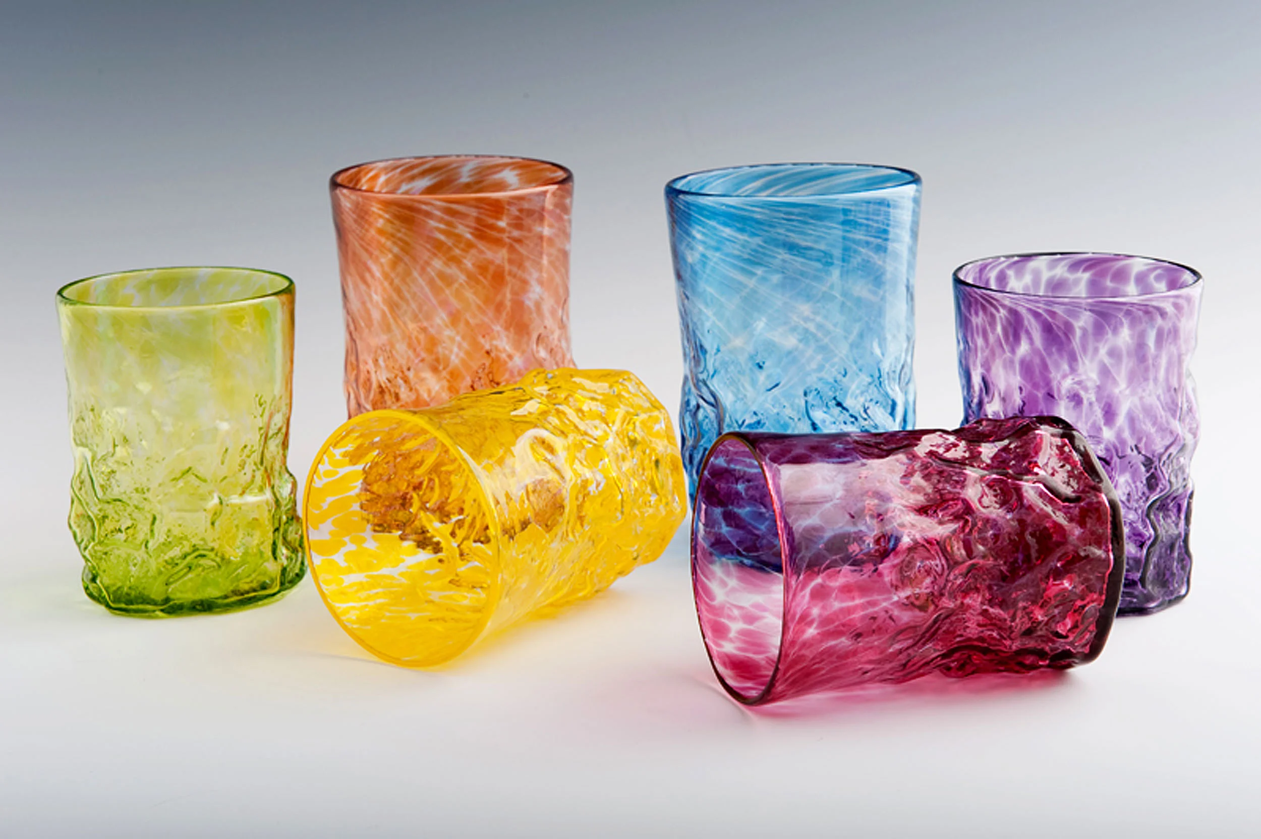 Rocks Tumblers seen here in Lime, Orange, Yellow, Blue, Red, and Purple (left to right). 