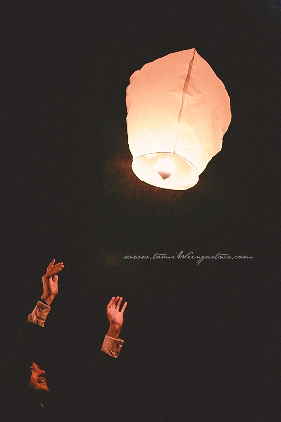 Guest releasing a lantern at a wedding in ligonier in the laurel highlands of pa