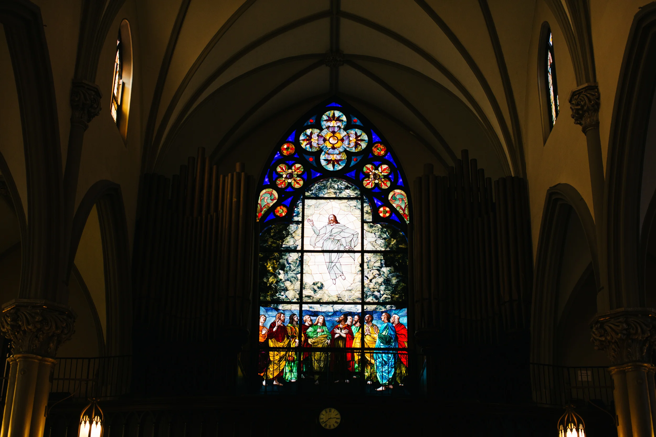 Beautiful stained glass glowing window at St. Mary’s on The Mount in Pittsburgh, PA the day of a wedding.