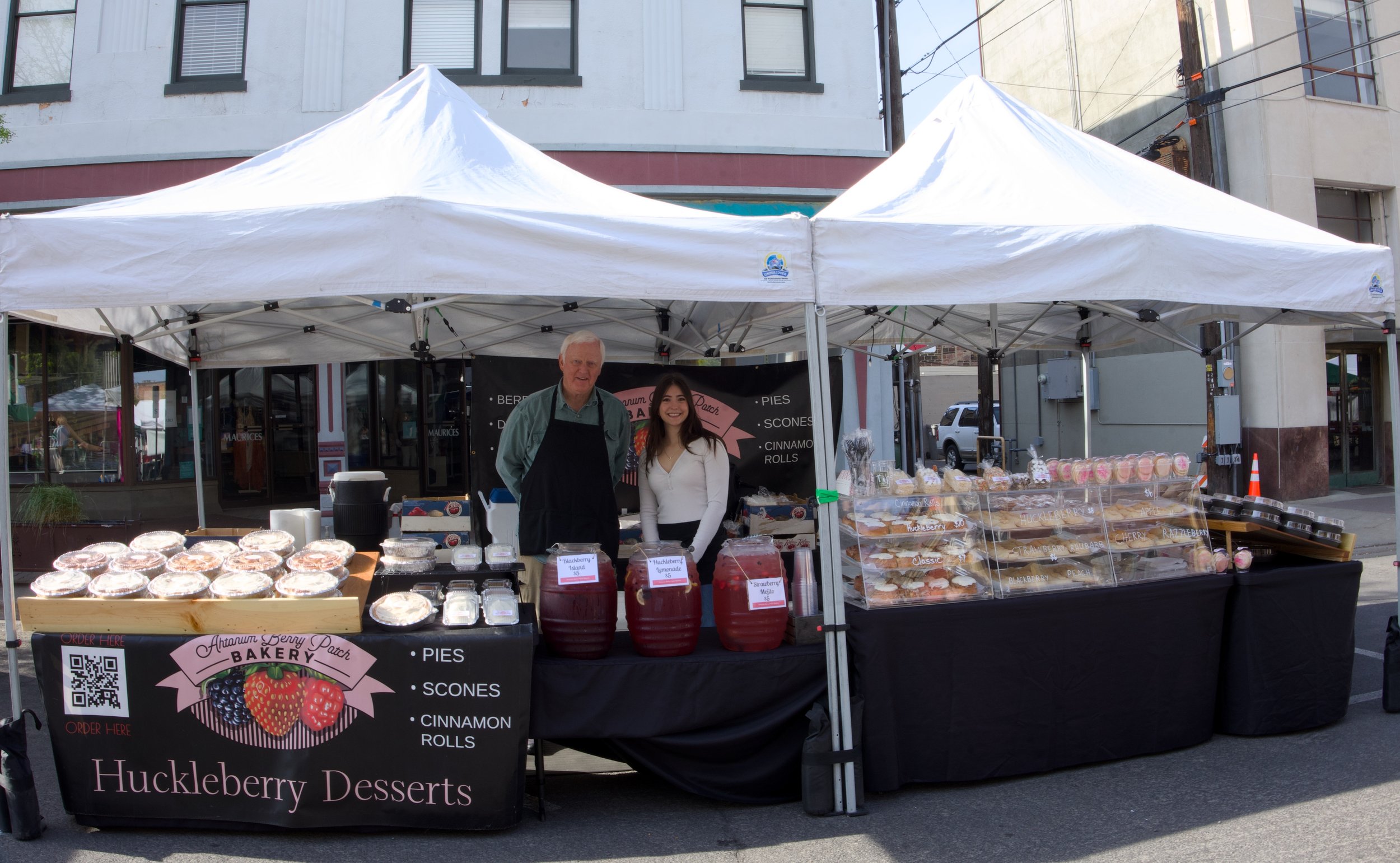 Huckleberry Desserts owners share huckleberry jams and other dishes at Farmers' Market opening day.jpg