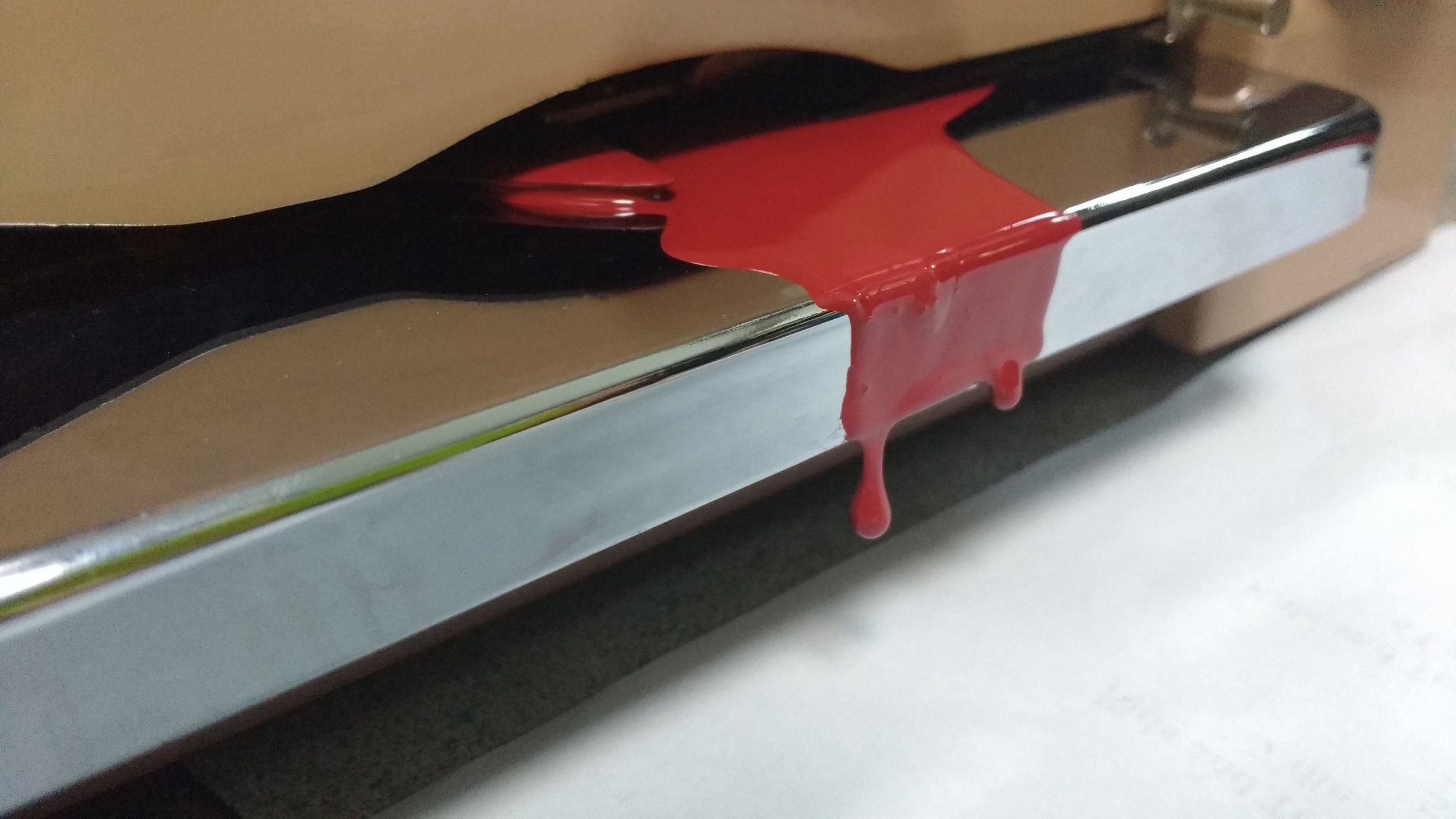 Blood on the check writing platform looks like it is oozing out of the machine 