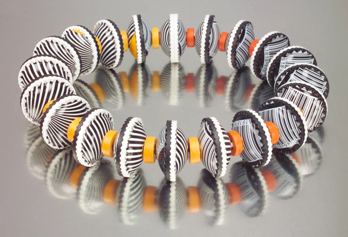 black white identity bead necklace gray background