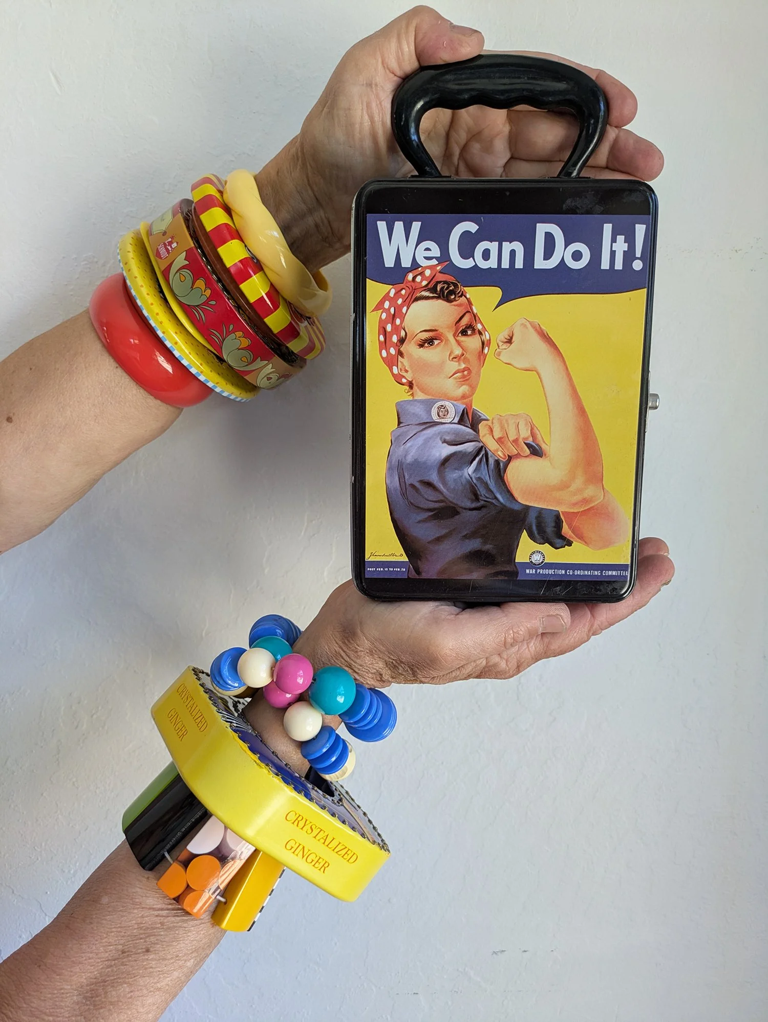Harriete Estel Berman showing off a fabulous selection of bracelets from recycled tin cans. w