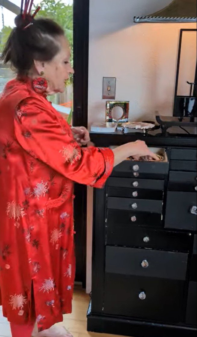 Harriete looking a Flower Pins.jpg