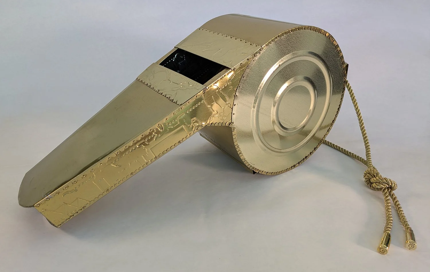 This is a very large whistle……much larger than you think. This whistle is constructed from recycled tin cans….mostly the tin can bottoms.