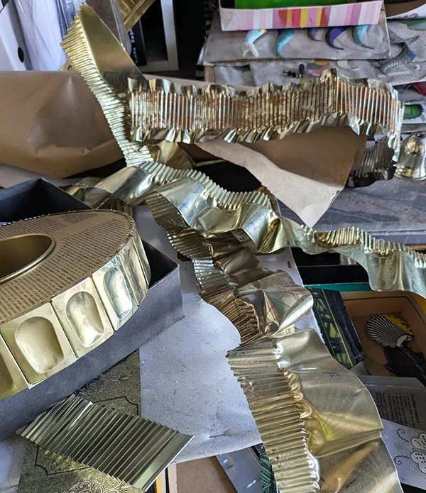 This is just the beginning of two new bracelets.   A little overwhelming and not enough time to do all the work I want to do.  These are all tin cans.