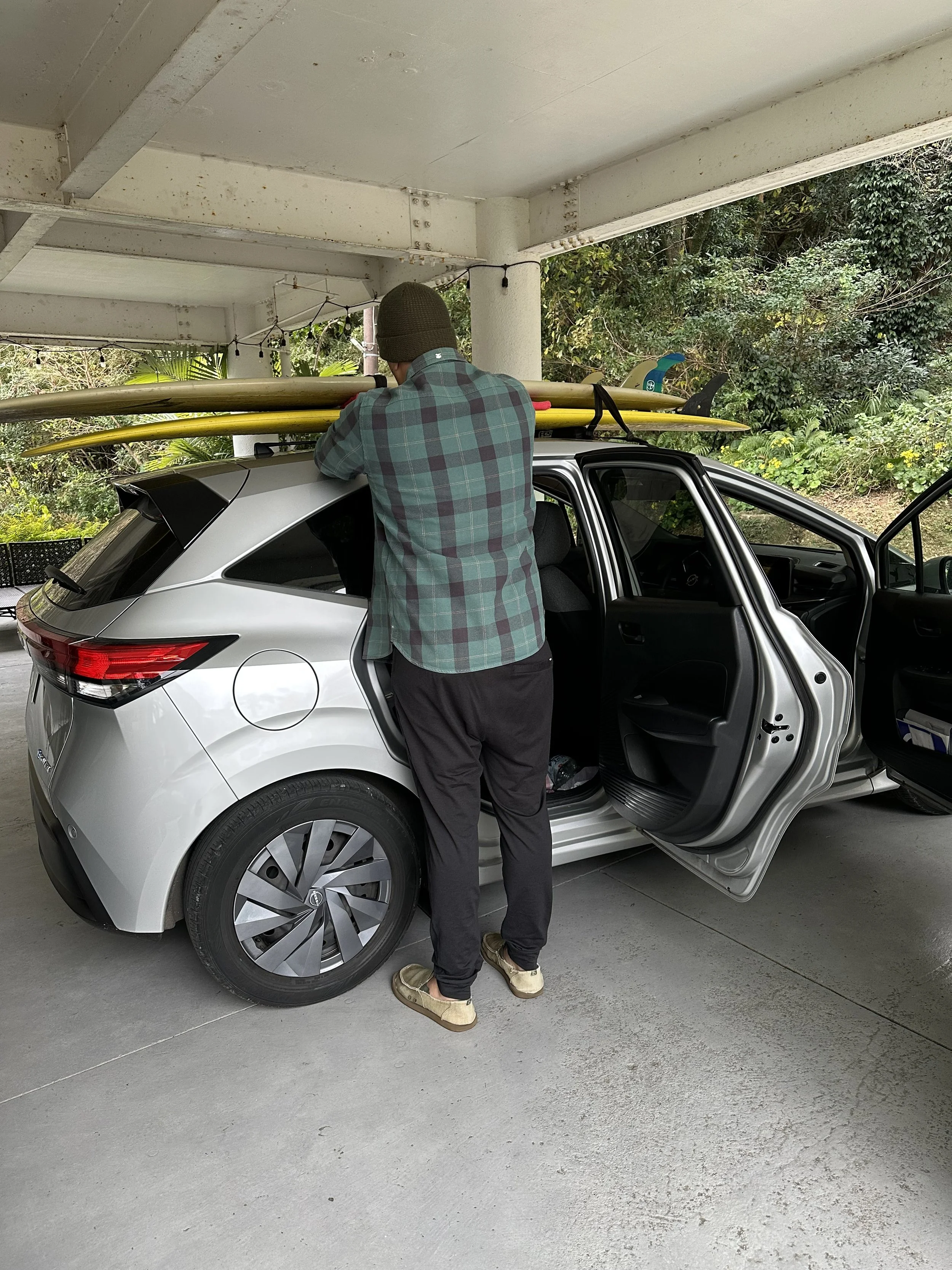 surfboards on top of a car