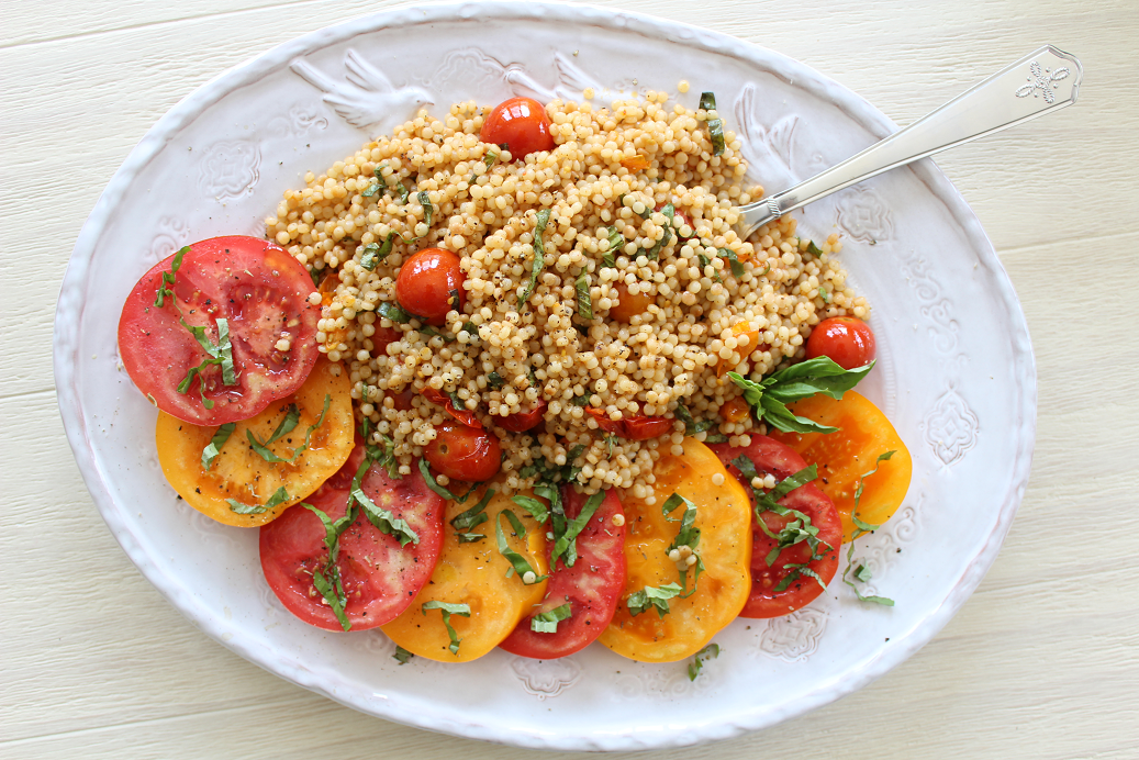 Roasted Tomato Couscous Salad pairs perfectly with big slices of heirloom tomatoes, dressed with olive oil and fresh basil. Serve for lunch, a light dinner, or as a stunning addition to brunch with family and friends!