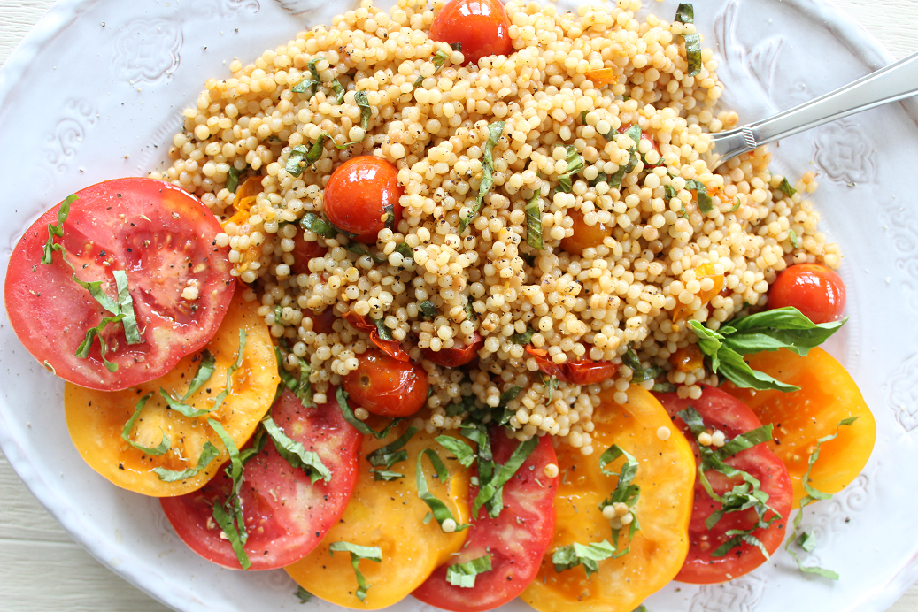 Roasted Tomato Couscous Salad pairs perfectly with big slices of heirloom tomatoes, dressed with olive oil and fresh basil. Serve for lunch, a light dinner, or as a stunning addition to brunch with family and friends!