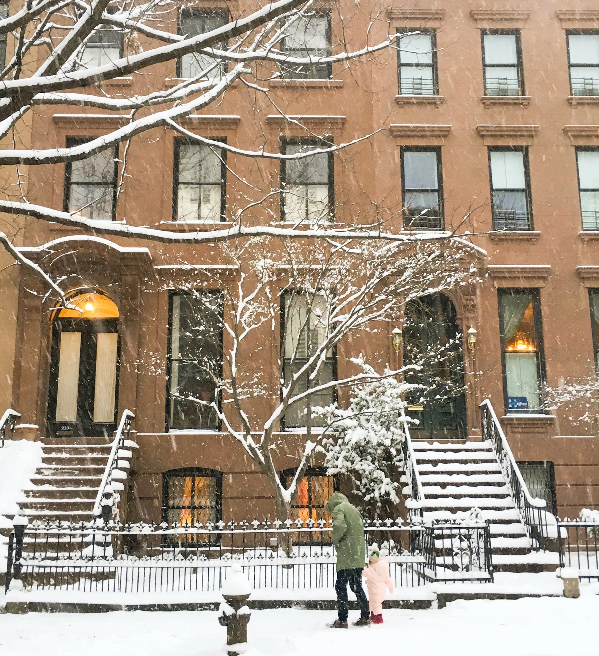 This little girl caught my eye, bravely walking through the snow with her red little boots... perhaps it was her first time walking in snow...