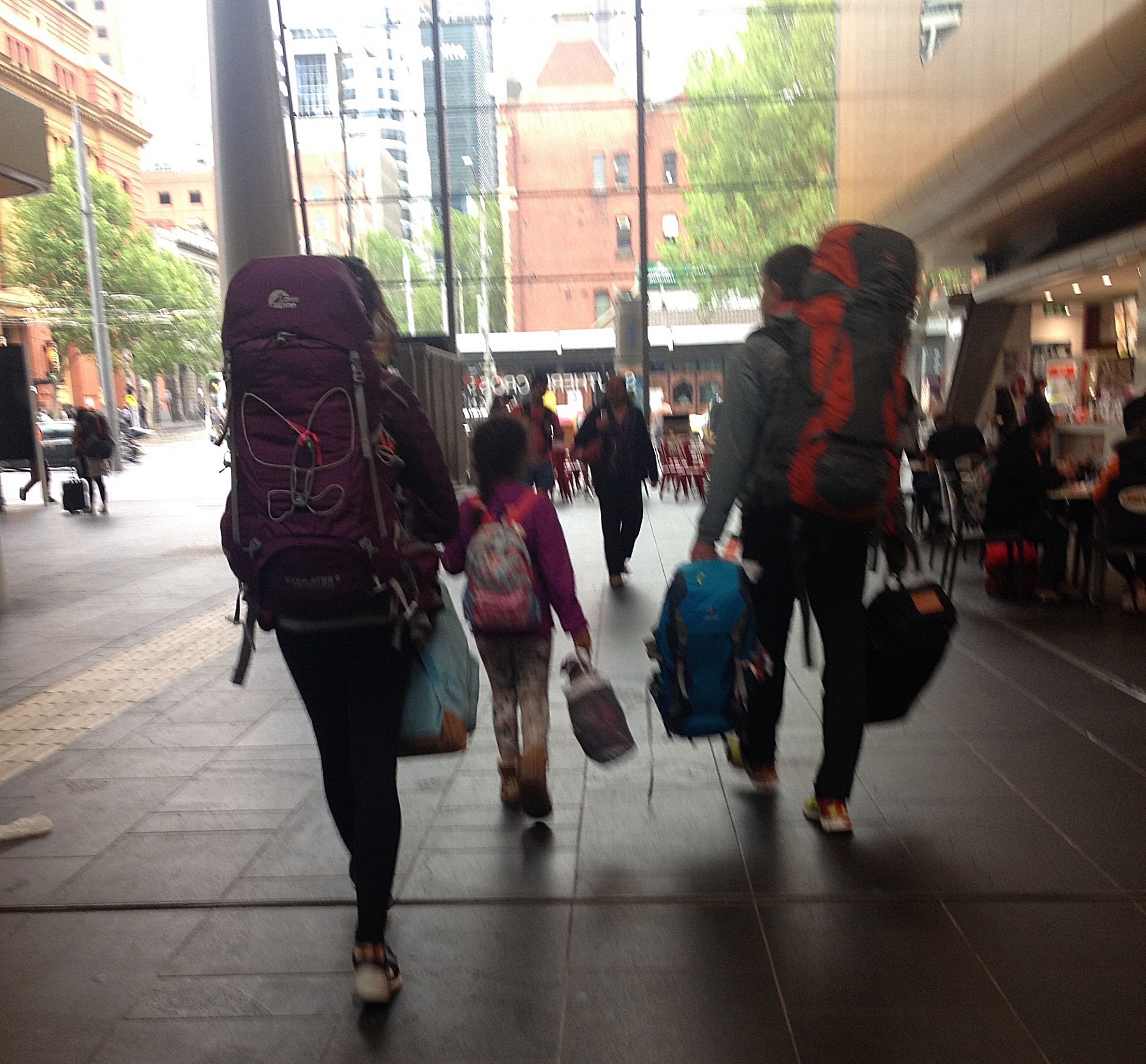 A blurry photo walking out of a train station in Melbourne. We all had one big and one smaller bag pack. (Zoe clearly convinced her father to carry her big bag...) I still like it - it shows exactly how it was at that moment.