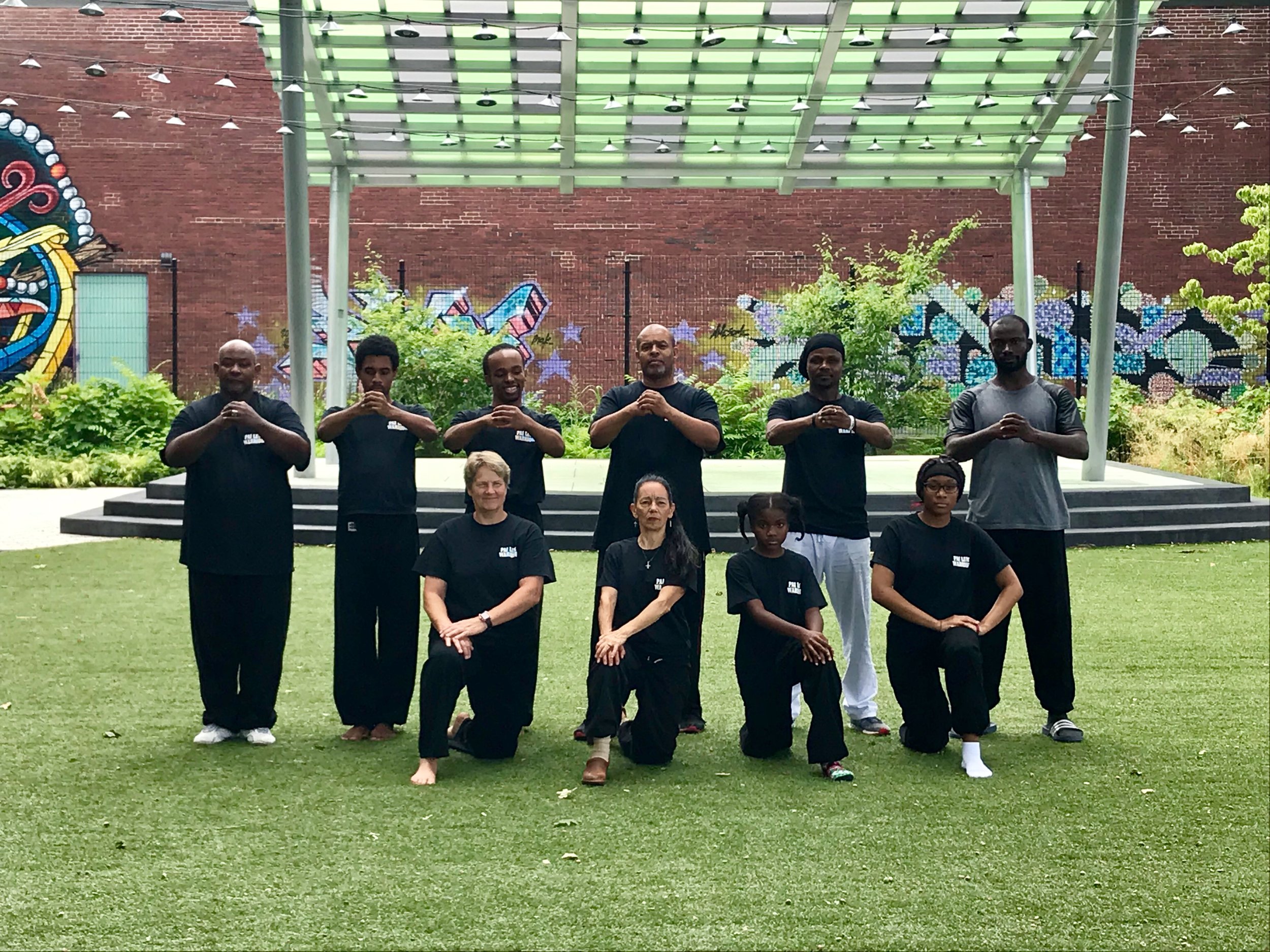 Back row Jelani Bey Juan Williams Jwan Cater Thomas Cater Woody Destiny Mani Religieux. Front row Sharyl Geisert Sharon Montella two young students 8.3.19.jpg