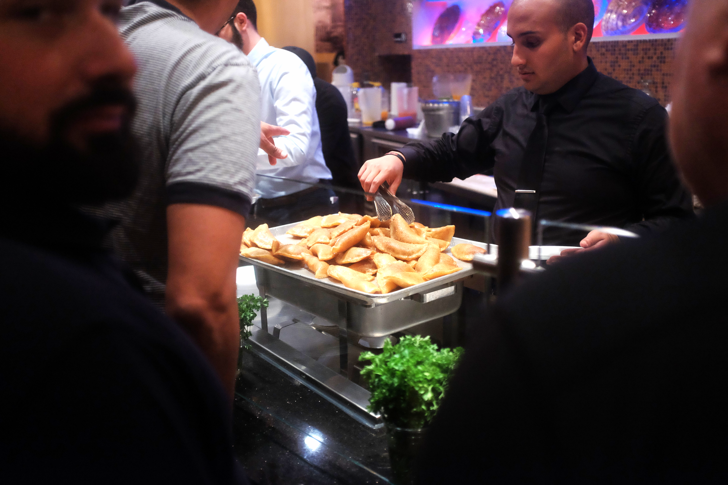 Patrons eagerly await their turn to enjoy some hulawiat ("Sweets"). These are stuffed with cheese or nuts, fried, and then sugared. Its good for the soul.