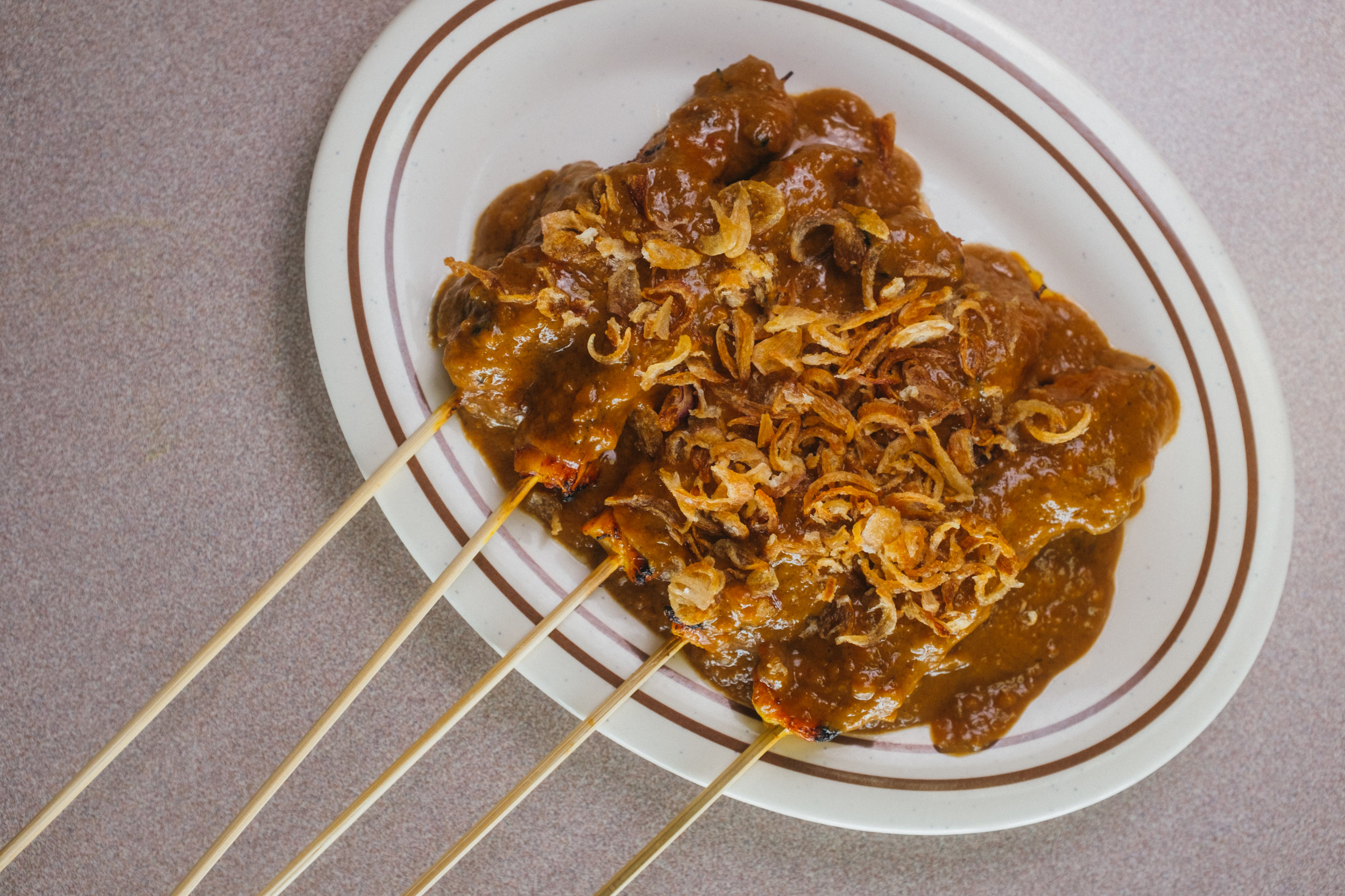 Satay. Grilled chicken, lamb, or beef drizzled in peanut sauce.