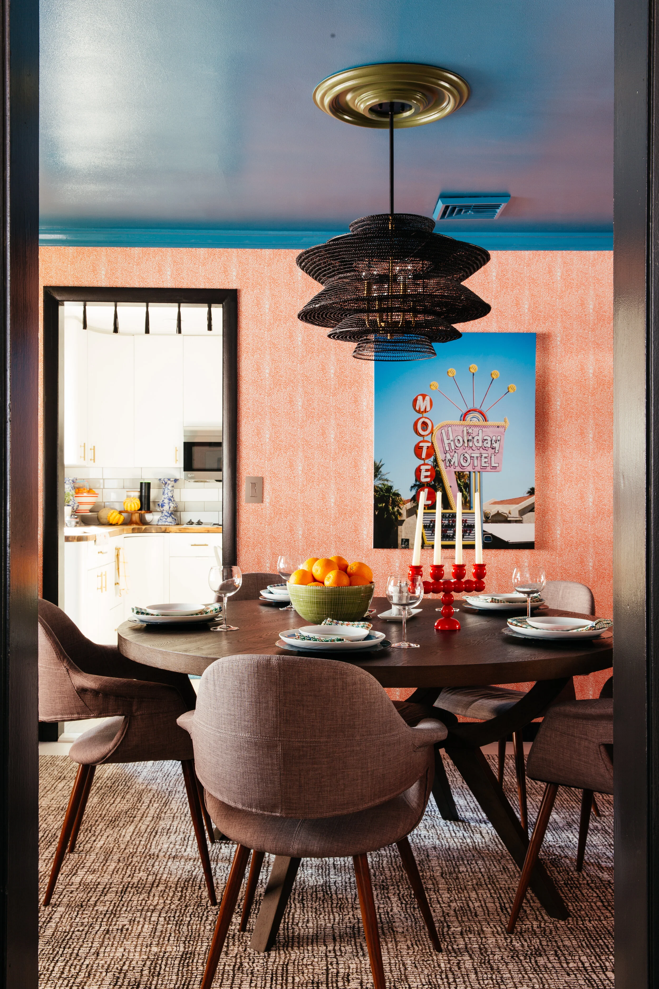 ORC dining room into kitchen from living room with sarinen style chairs lamps plus and motel art by minted design by TheRathProject.jpg