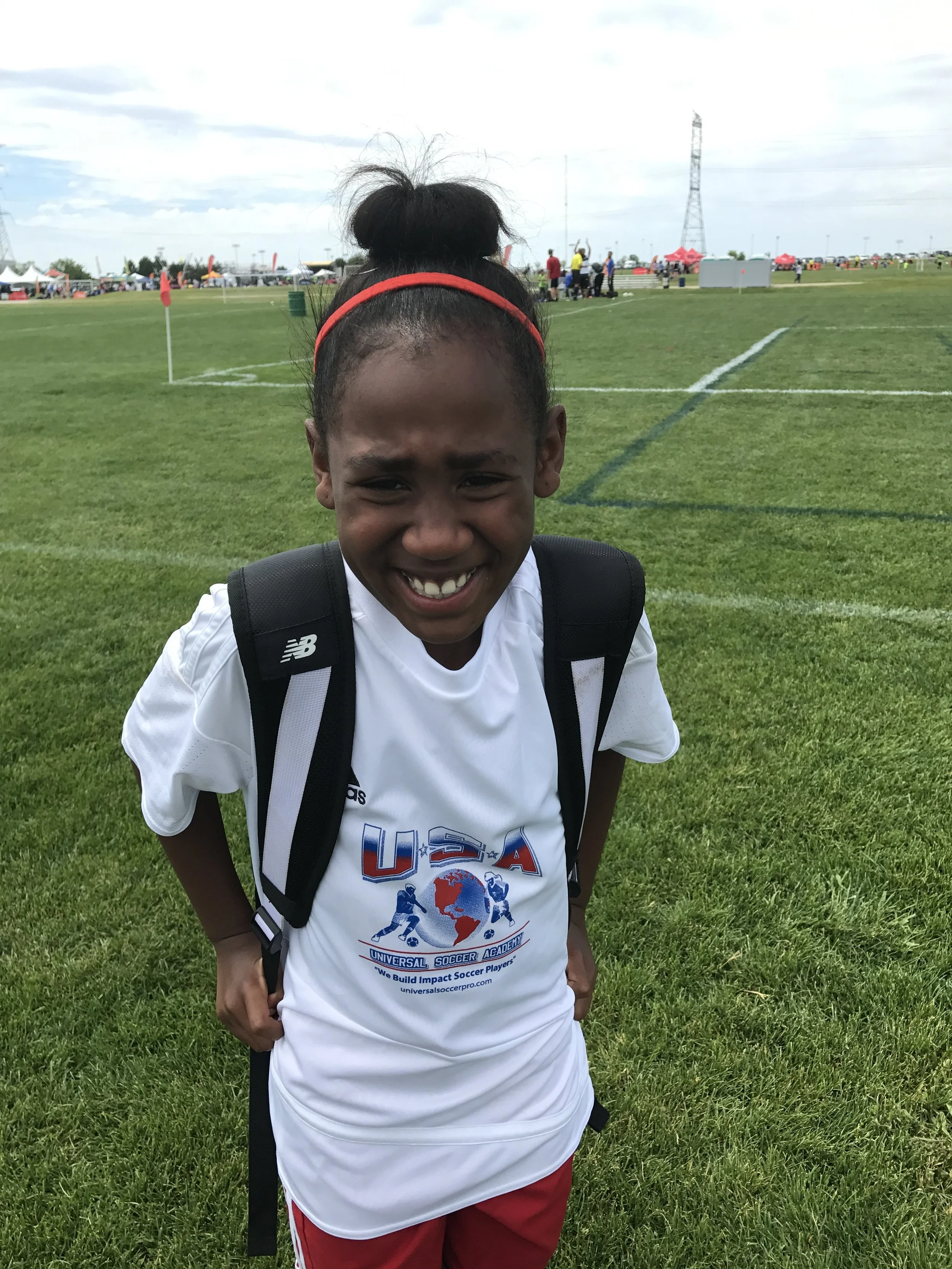 Young Soccer Players poses for team give and go camera